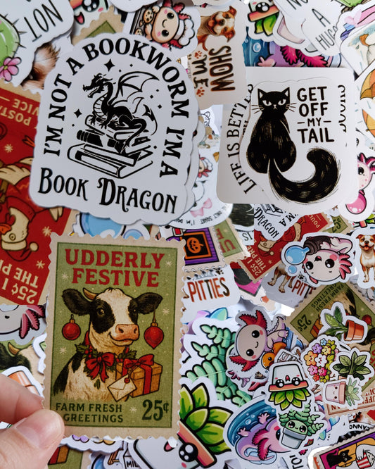 Collection of various stickers with different designs and text.